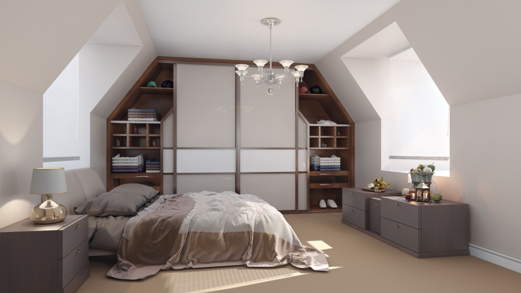 A cozy, well-lit attic bedroom featuring a large bed with beige and brown bedding, built-in fitted wardrobes, and a classic chandelier. Two windows provide natural light, and small decorative items add charm.