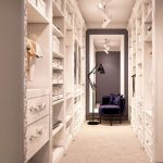 Walk-in wardrobe with velvet stool