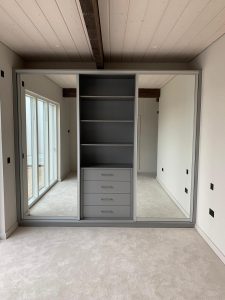 storage space in a wardrobe with sliding doors