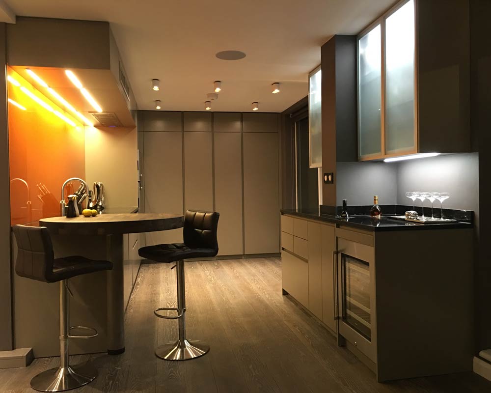 Fitted Kitchen in Grey Colour with integrated lighting