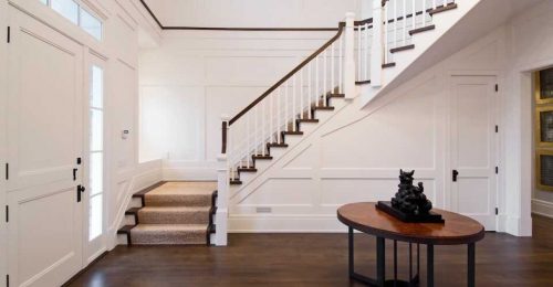 Space under staircase in a classic house. An example of under stairs storage ideas. 