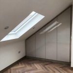 Fitted wardrobe in loft conversion with slope
